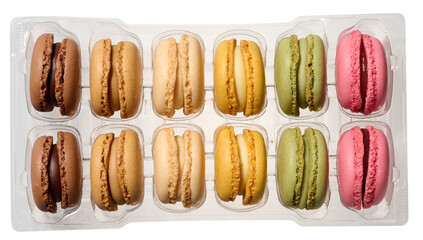 Macarons in plastic box on isolated background, top view