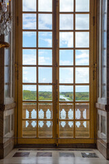 looking outside of window in the Versailles Palace in Paris, France 