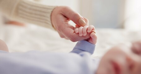 Parents, family and holding hands with baby on bed for bonding, love and relationship with infant. Adorable, cute and closeup of mom with hand of newborn for support, wellness and protection at home - obrazy, fototapety, plakaty