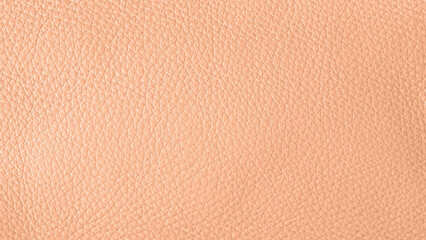 Peach fuzz color natural leather sample texture . Abstract leather background in trendy color 2024 year Peach Fuzz