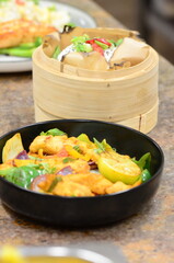 asian food sweet and sour chicken with vegetables and steamed rice , food background