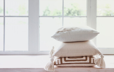Windowsill with light pillows