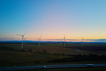 Aerial view of wind turbine in countryside area, Wind power plants in agricultural landscape at...