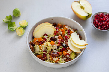 Autumn salad with brusell sprouts, butternut squash, pecans and pomegranate