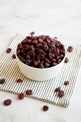 Organic Dried Cranberries in a Bowl, side view.