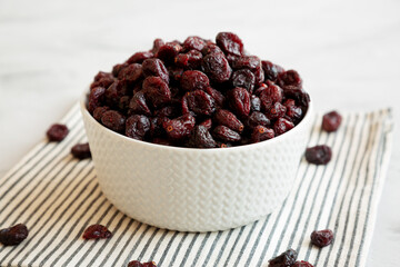 Organic Dried Cranberries in a Bowl, side view.