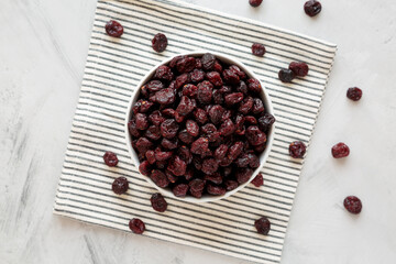 Organic Dried Cranberries in a Bowl, top view. Flat lay, overhead, from above.