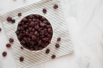 Organic Dried Cranberries in a Bowl, top view. Copy space.