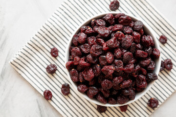 Organic Dried Cranberries in a Bowl, top view. Flat lay, overhead, from above.
