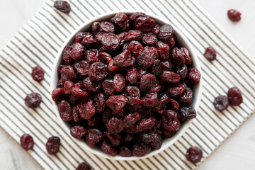 Organic Dried Cranberries in a Bowl, top view. Flat lay, overhead, from above.