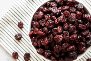 Organic Dried Cranberries in a Bowl, top view. Flat lay, overhead, from above. Close-up.