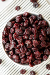 Organic Dried Cranberries in a Bowl, top view. Flat lay, overhead, from above. Close-up.