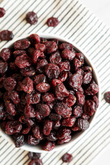 Organic Dried Cranberries in a Bowl, top view. Flat lay, overhead, from above.