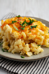 Homemade Baked Mac and Cheese on a Plate, side view. Close-up.