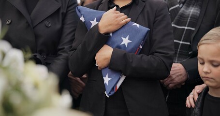 Funeral, cemetery and woman with American flag for veteran for respect, ceremony and memorial service. Family, depression and sad people by coffin in graveyard for military, army and soldier mourning - obrazy, fototapety, plakaty
