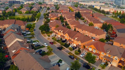 Drone view of American residential area, showcasing suburban single-floor houses in USA Typical...