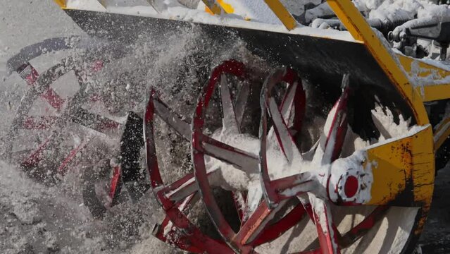 Snow removing on the mountain highway. snowblower