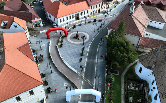 ZĂRNEȘTI, BRAȘOV, ROMANIA – SEPTEMBER 30, 2023: An aerial view of the town square, with the Heroes Monument at the center. It was erected in the memory the soldiers who fell in the two World Wars.