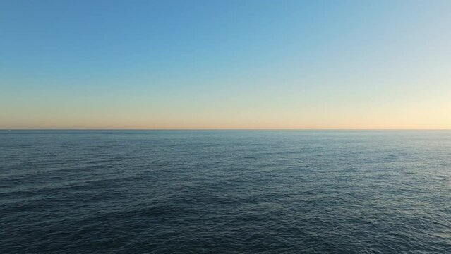 Horizon Is Divided Into Light Blue Sky And Blue Sea.