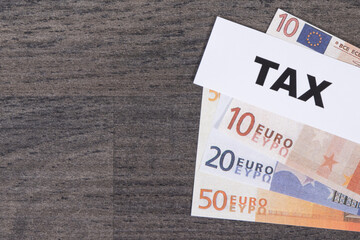 Inscription tax and euro banknotes. Calculating and paying tax. Place for text