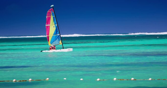 People sailing with catamaran sailboat in caribbean sea, tropical vacation 4k Video