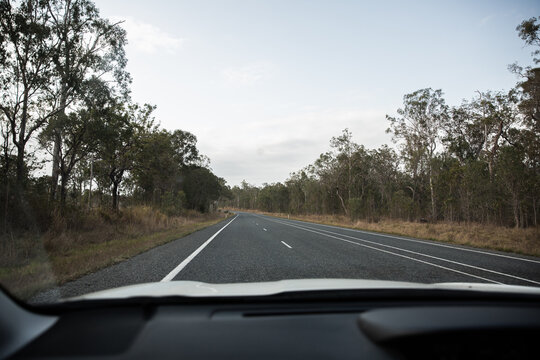 the view out through the windscreen driving up the Bruce Highway in Central Queensland