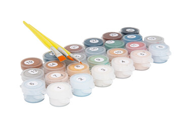 Set of pastel acrylic paints in small plastic cans with numbers isolated on a white background with...