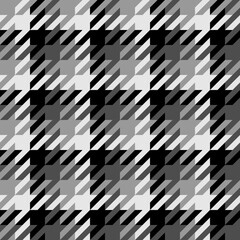 Black white seamless a large checked pattern with notched corners suggestive of a canine tooth.