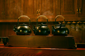 Iron tea containers in a traditional tea house in Murakami City, Japan.