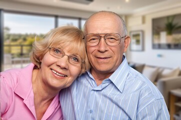 Happy senior hugging in living room