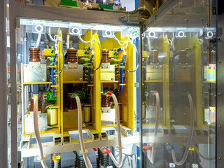 High voltage equipment. Electrical panel with open door. Electric transformer. Power equipment with...