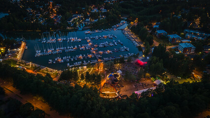 Evening aerial view of a festival in Espoo with colorful lights
View to dock with reflecting sunset sky