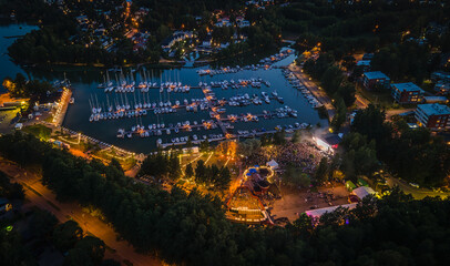 Evening aerial view of a festival in Espoo with colorful lights
View to dock with reflecting sunset sky