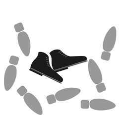  a pair of black shoes and footprints