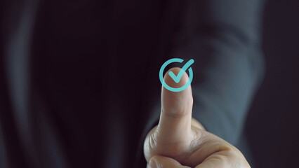 Closeup of hand thumb up with virtual correct sign or tick mark for approve quality assurance and...