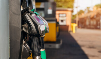 Close up of diesel and petrol fuel pistols at a gas station. The fuel crisis continues and the cost...