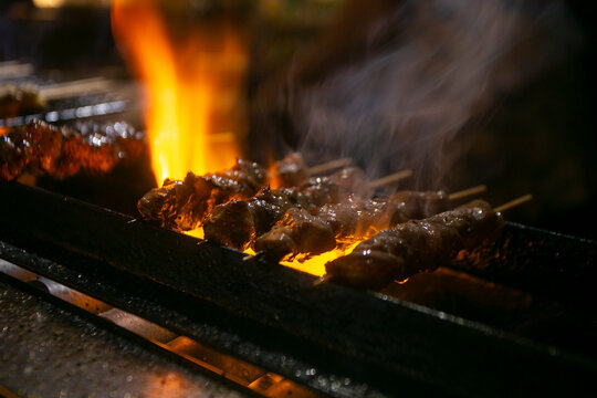 Grilled yakitori chicken skewers at an Izakaya restaurant in Omoide Yokocho street in the Shinjuku district of Tokyo.