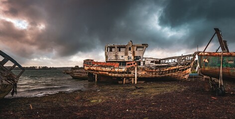 Broken rusty boats in the harbour