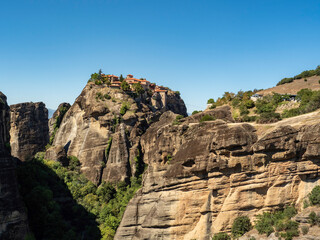 Fototapeta na wymiar rock in the mountains, Panoramic view of Meteora monastery on the high rock and road in the mountains, Greece