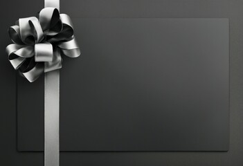 Template for a gift card featuring a silver ribbon design on a black paper background