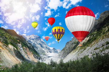 Fototapeta premium Bright hot air balloons flying in mountains