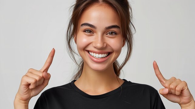 Portrait of an American woman in black t shirt indicating her smile with fingers against a clean white backdrop with copy space, Generative AI.