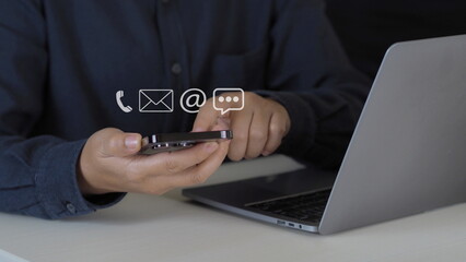 Customer support hotline Contact us people connection. Businessman using Smart Phone with the email, call phone, address, Chat message icons.