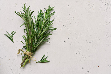 Bunch of rosemary and garlic head - traditional ingredients of mediterranean cuisine. Top view with...