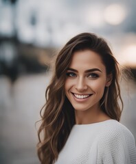 Fototapeta premium Portrait of a beautiful young woman smiling and looking at camera isolated on a white background