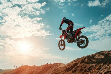 Motocross rider on the jump on the background of blue sky. Motocross. Enduro. Extreme sport concept.