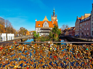 Gdansk, Poland  March 21, 2023: Millers Guild House and Love Bridge on the canal in Gdansk old...