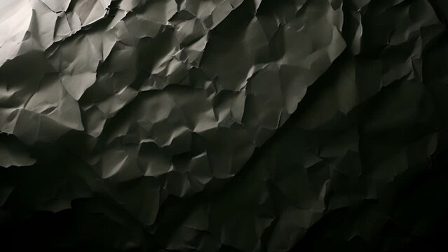 Black crumbled paper background texture. Black crumpled paper texture. Stop Motion. Seamless Looped. Grunge Paper Texture Noise Animated Stop Motion Background and Overlays. texture effect moving mp4