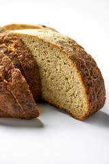 Sliced rye eco bread on a gray background. Minimalist composition