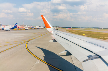 View from the airplane window during takeoff at Sheremetyevo airport at summer